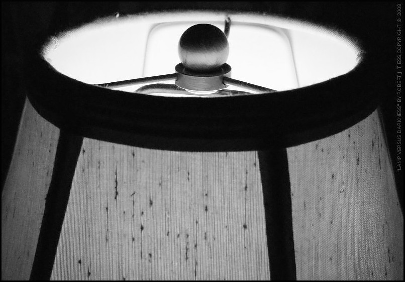 Lamp Versus Darkness - By Robert J. Tiess